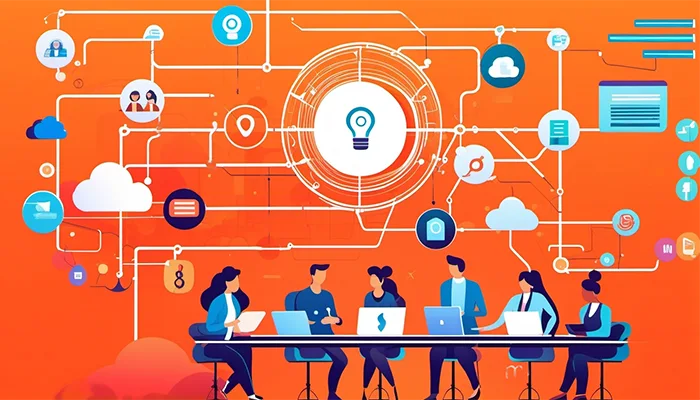 Kuvituskuva, jossa kuusi henkilöä istuvat tietokoneiden ääressä keskustellen. Heidän yläpuolelleen rakentuu kaaviomainen rakenne, jossa erilaiset kuvakkeet yhdistyvät. Tämä kuvastaa ideointia.